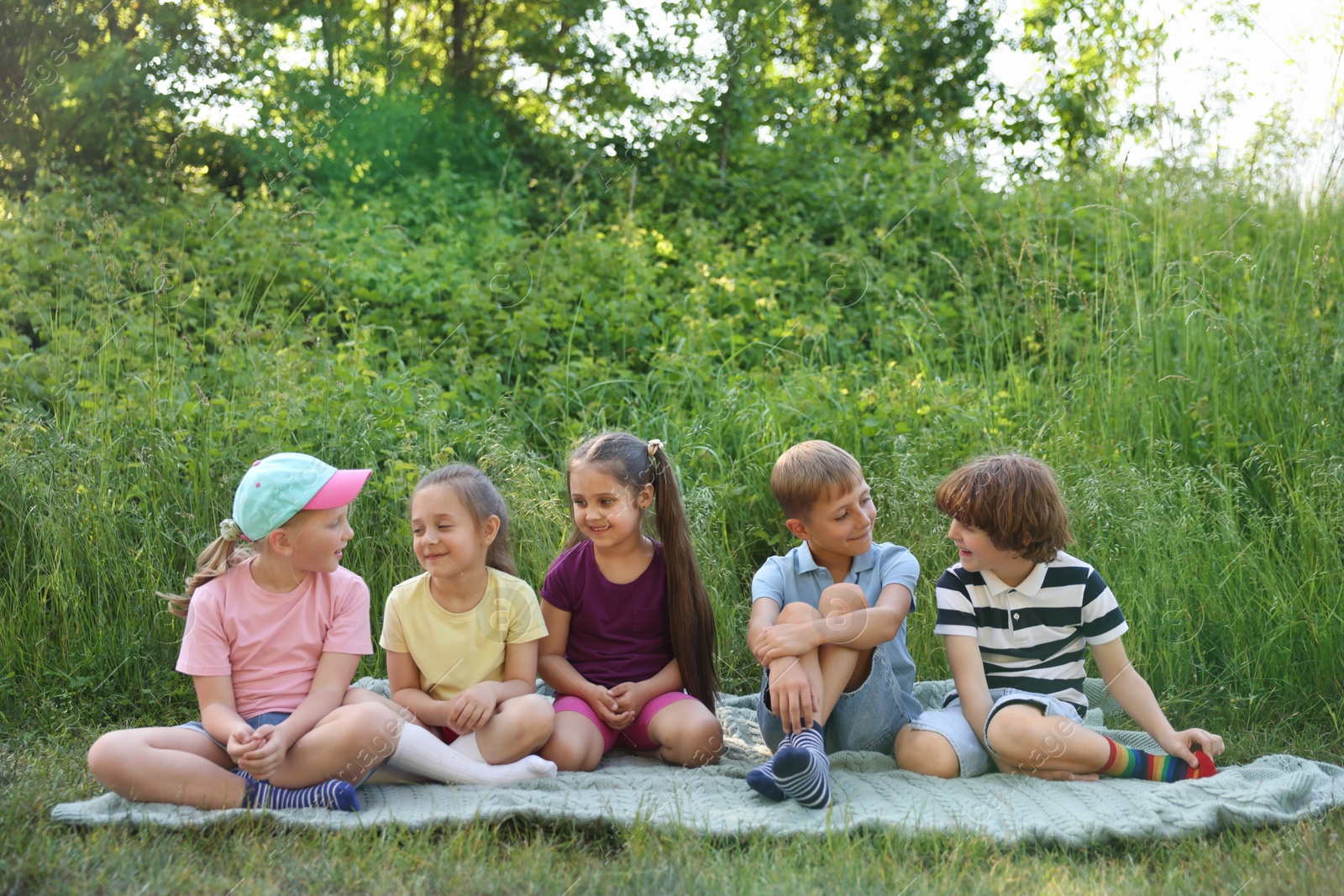 Children spending time in nature on summer day Photo of Children spending time in nature on summer day