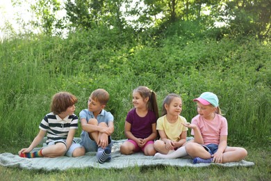 Photo of Children spending time in nature on summer day
