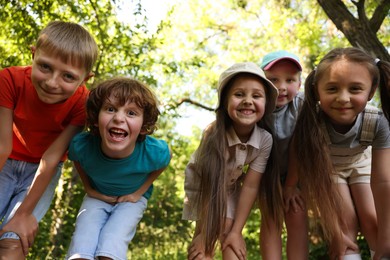 Photo of Cute children in nature, low angle view