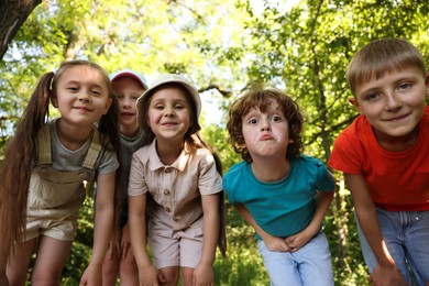 Photo of Cute children in nature, low angle view