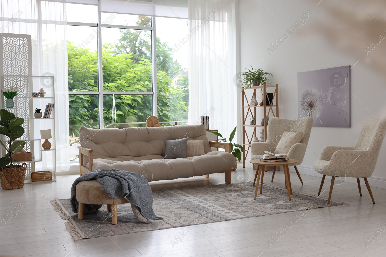 Photo of Stylish sofa and other furniture in living room. Interior design
