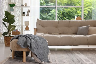 Photo of Stylish sofa and other furniture in living room. Interior design