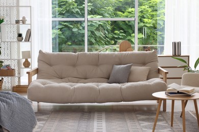Photo of Stylish sofa and other furniture in living room. Interior design
