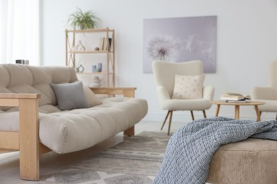 Photo of Stylish sofa and other furniture in living room. Interior design