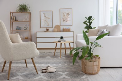 Photo of Stylish sofa and other furniture in living room. Interior design