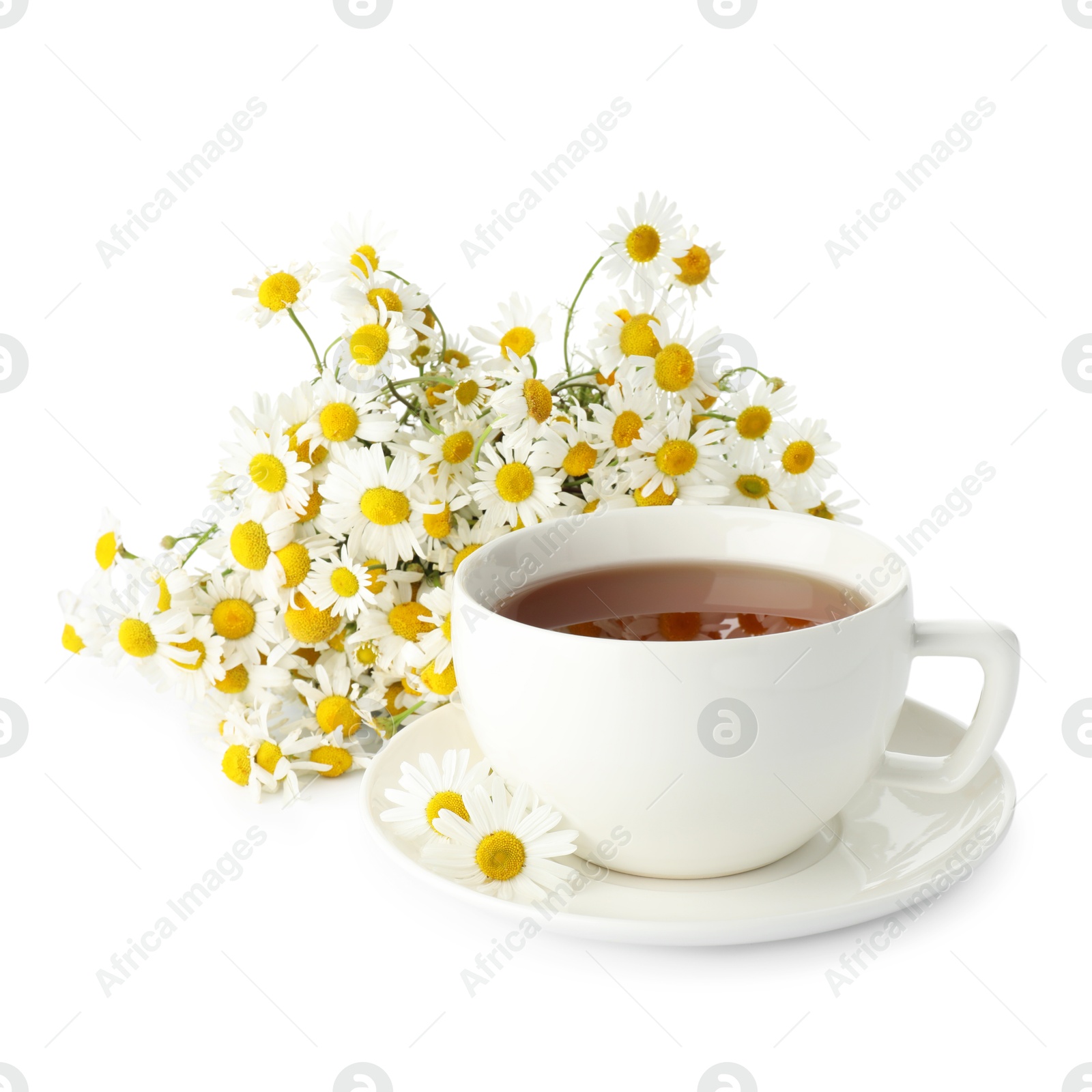 Photo of Aromatic tea in cup and chamomile flowers isolated on white