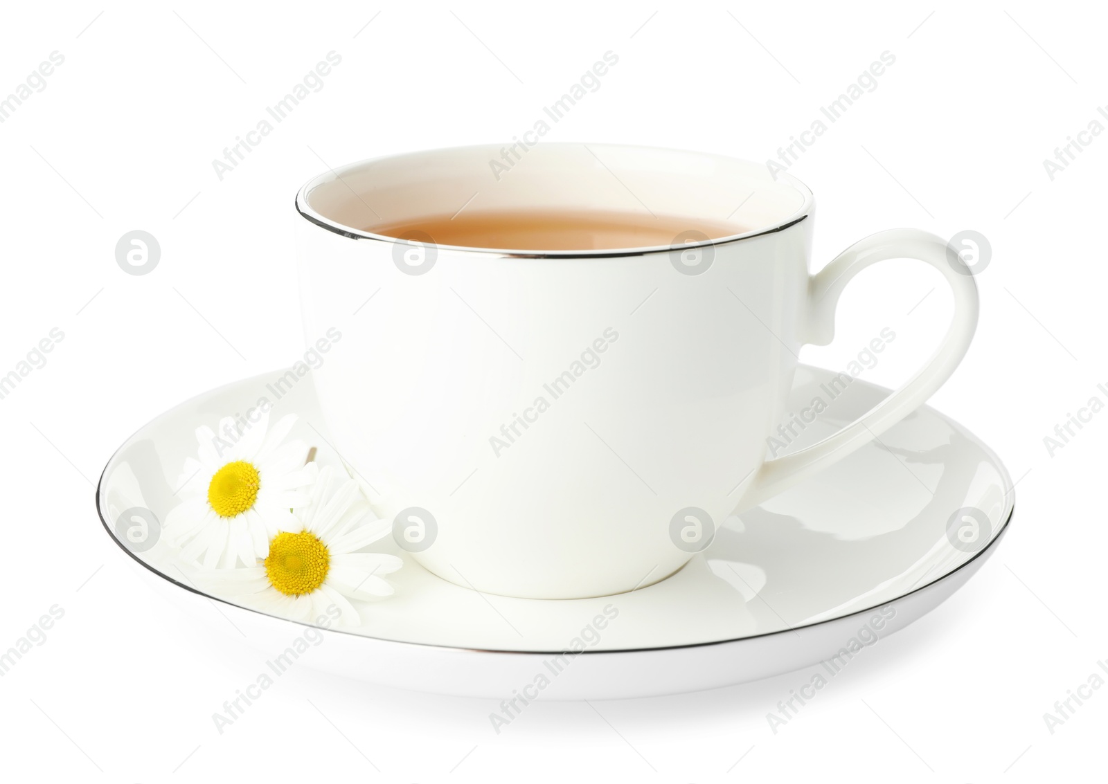 Photo of Aromatic tea in cup and chamomile flowers isolated on white