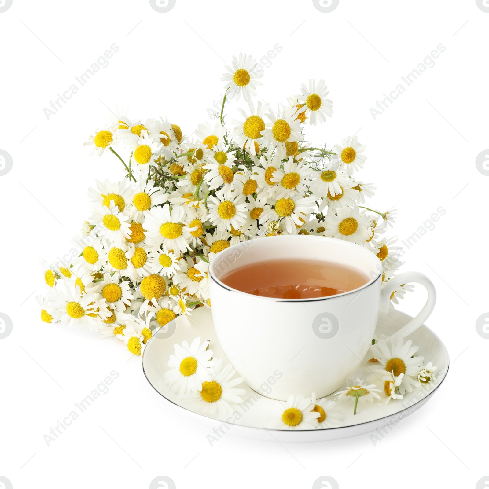 Photo of Aromatic tea in cup and chamomile flowers isolated on white