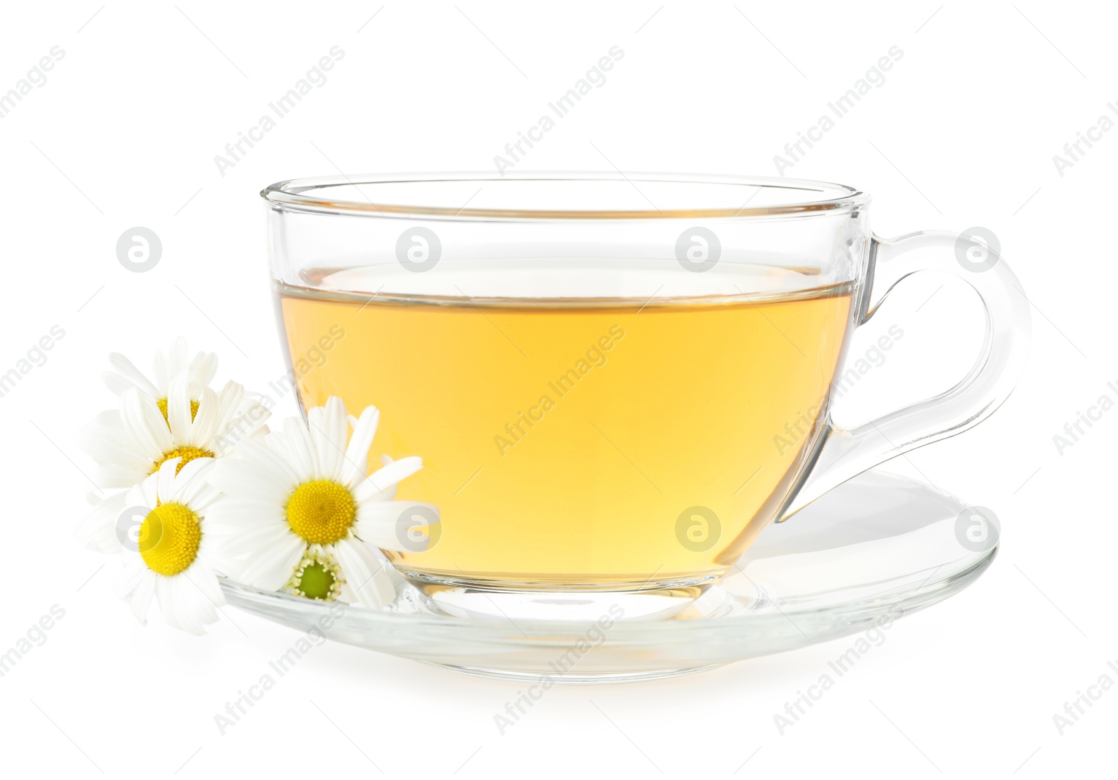Aromatic tea in glass cup and chamomile flowers isolated on white Photo of Aromatic tea in glass cup and chamomile flowers isolated on white