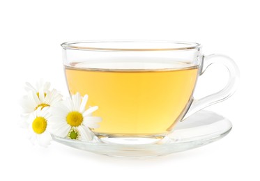 Photo of Aromatic tea in glass cup and chamomile flowers isolated on white