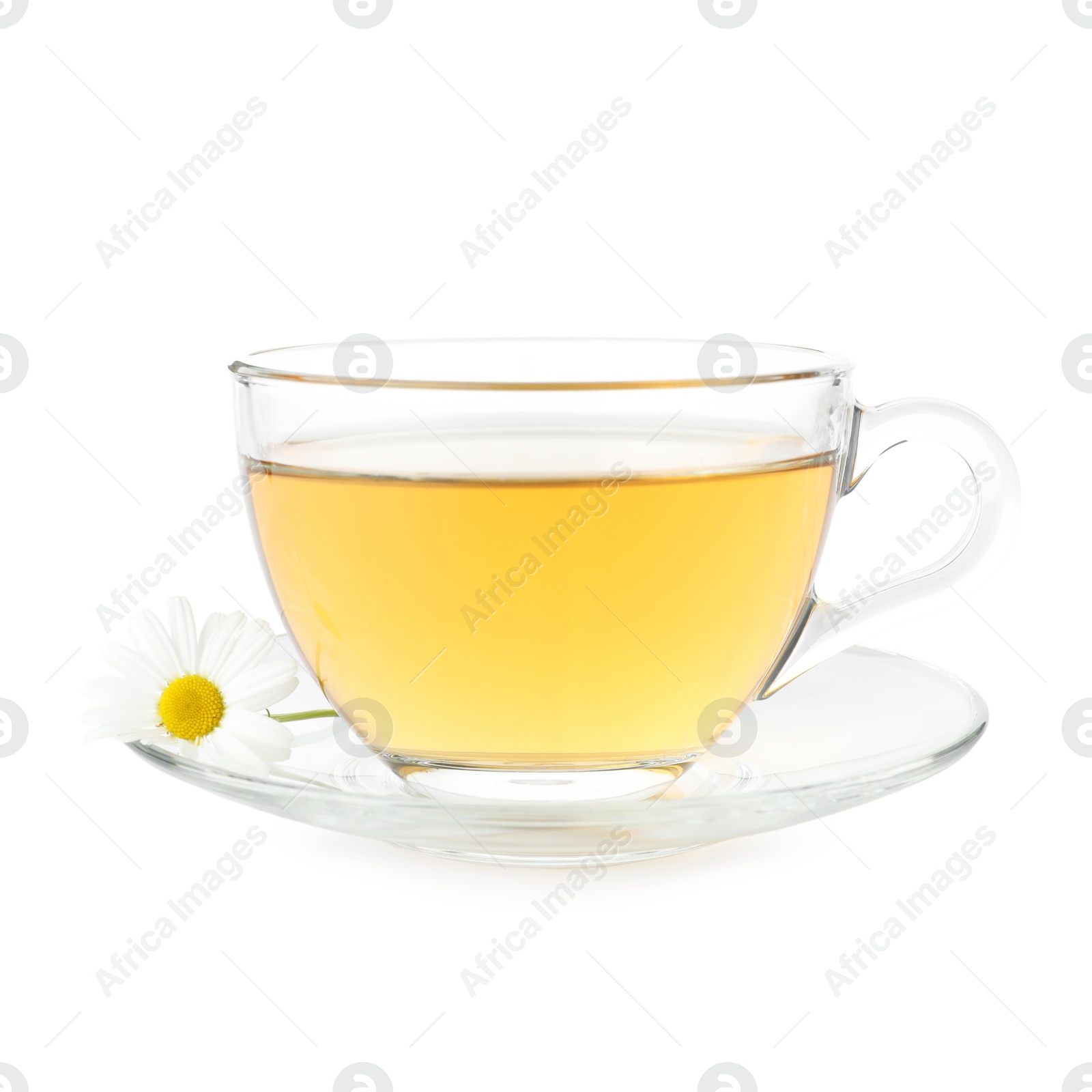 Aromatic tea in glass cup and chamomile flowers isolated on white Photo of Aromatic tea in glass cup and chamomile flowers isolated on white