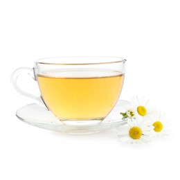 Photo of Aromatic tea in glass cup and chamomile flowers isolated on white