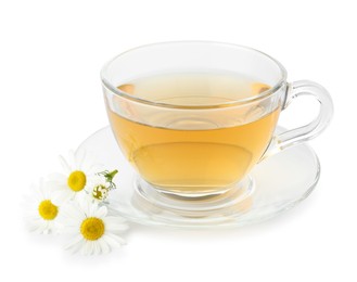 Photo of Aromatic tea in glass cup and chamomile flowers isolated on white