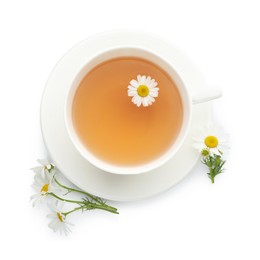 Photo of Aromatic tea in cup and chamomile flowers isolated on white, top view