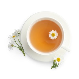 Photo of Aromatic tea in cup and chamomile flowers isolated on white, top view
