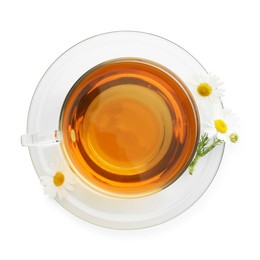 Photo of Aromatic tea in glass cup and chamomile flowers isolated on white, top view