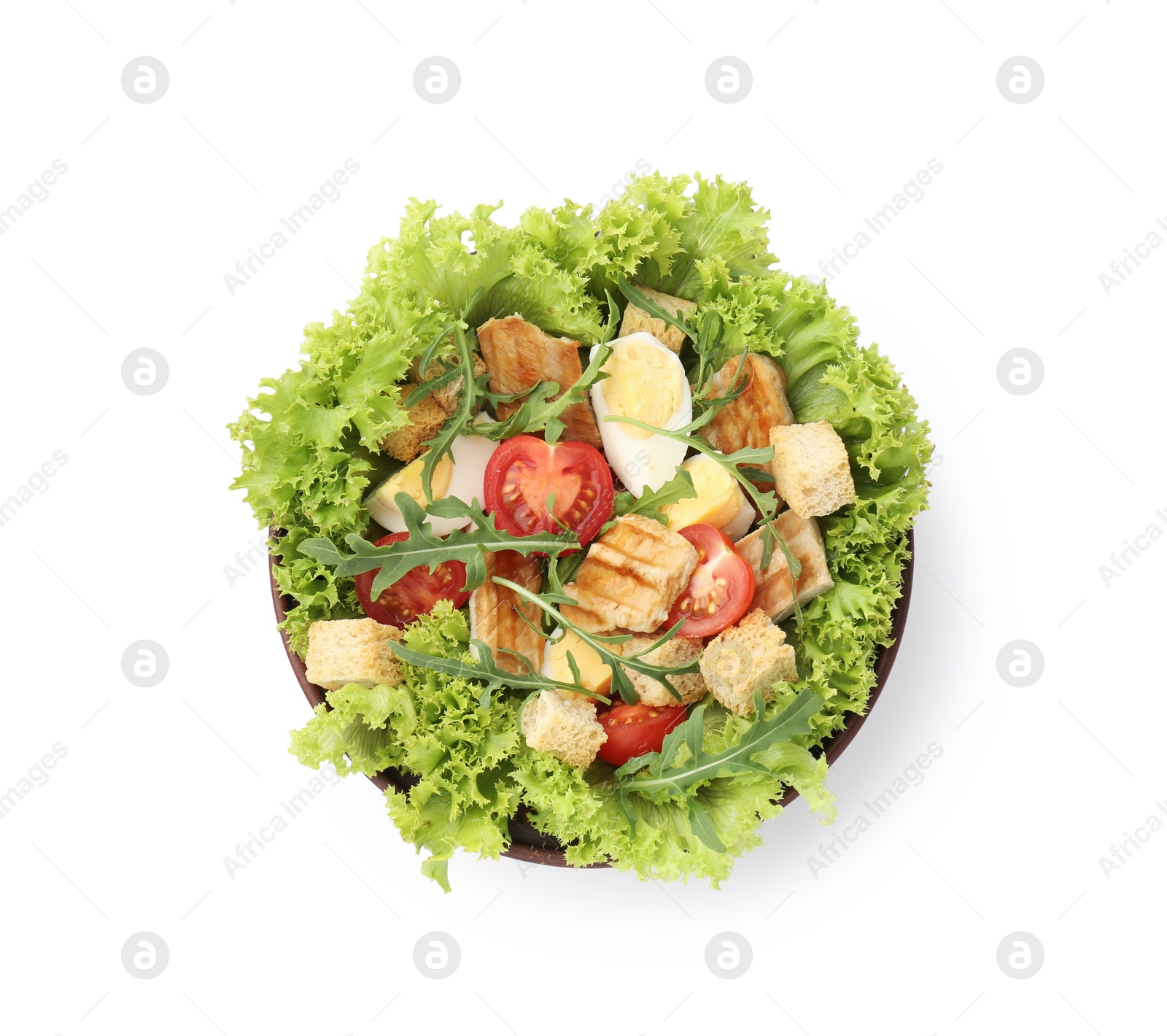Photo of Delicious salad with croutons, chicken, egg, vegetables and arugula isolated on white, top view