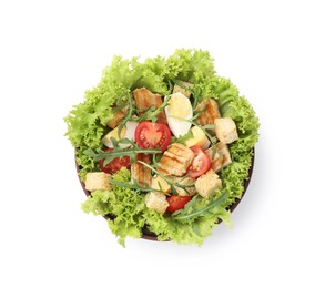 Photo of Delicious salad with croutons, chicken, egg, vegetables and arugula isolated on white, top view