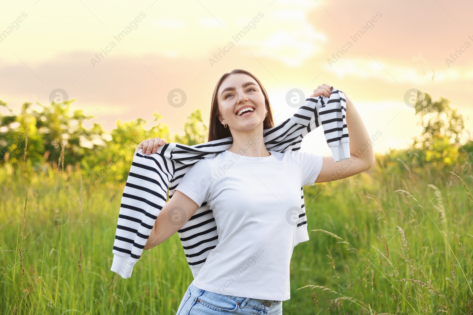 Photo of Feeling freedom. Happy young woman enjoying time in nature