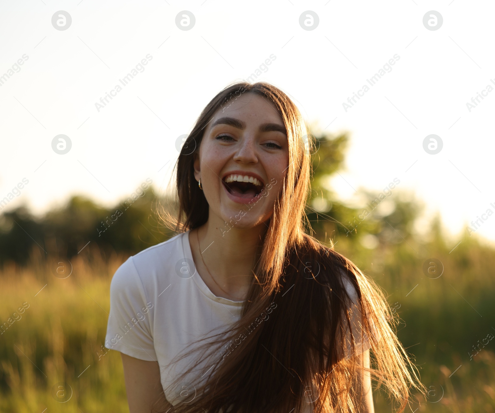 Photo of Feeling freedom. Happy young woman in nature