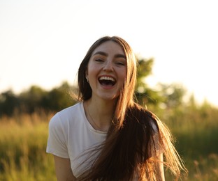 Photo of Feeling freedom. Happy young woman in nature
