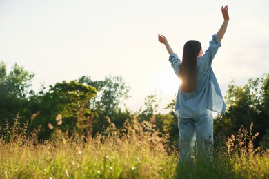 Photo of Feeling freedom. Woman enjoying time in nature, low angle view. Space for text