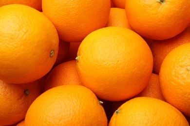 Photo of Fresh ripe oranges as background, top view
