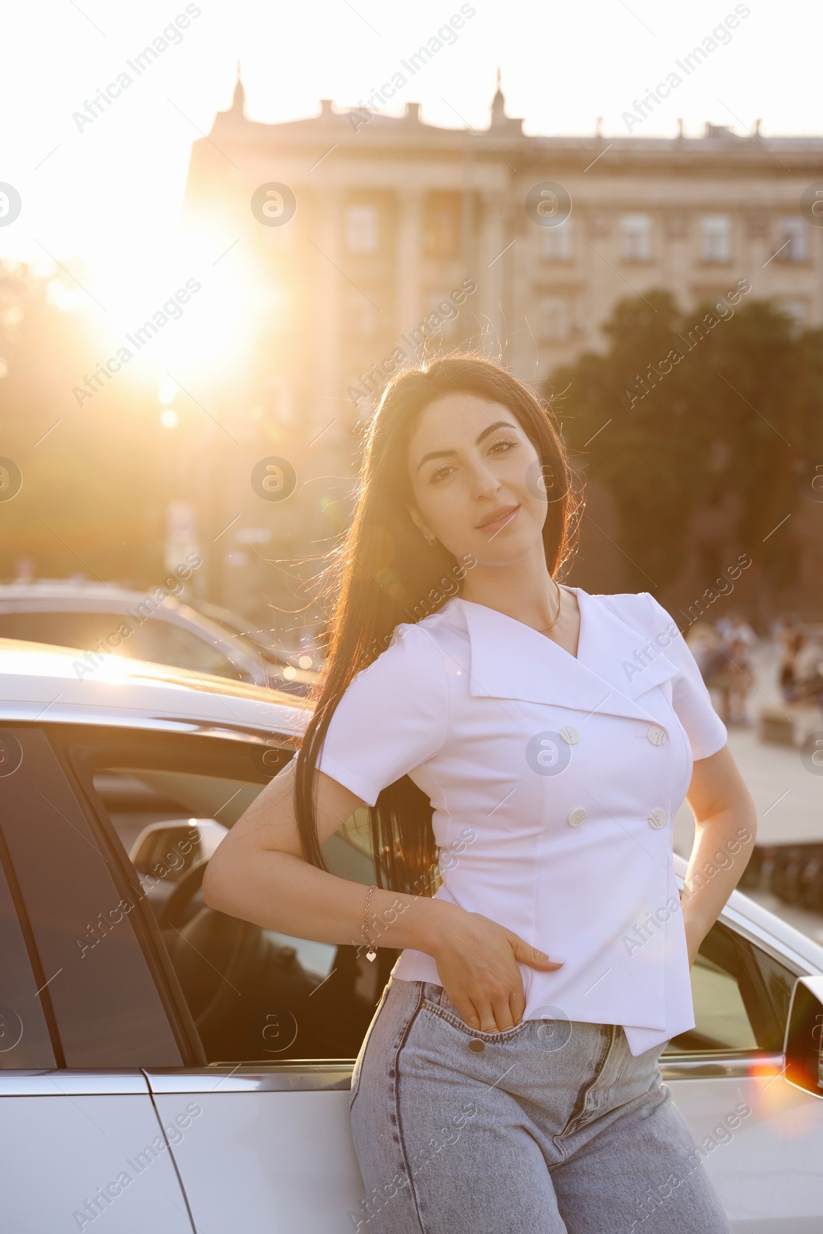 Photo of Beautiful woman near modern car outdoors on sunny day