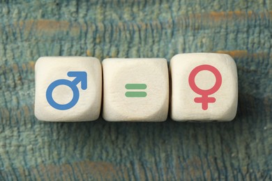 Image of Sex education. Cubes with female and male gender symbols and equals sign on wooden background, top view