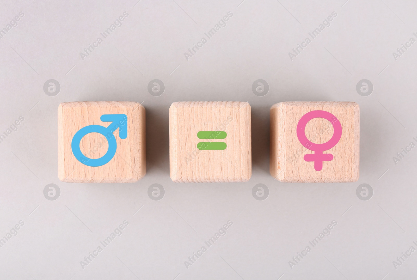Sex education. Wooden cubes with female and male gender symbols and equals sign on white background, top view Image of Sex education. Wooden cubes with female and male gender symbols and equals sign on white background, top view