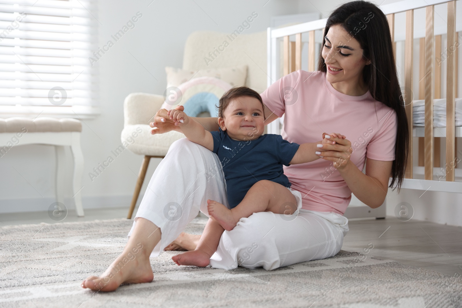 Happy mother with her cute little baby at home Photo of Happy mother with her cute little baby at home