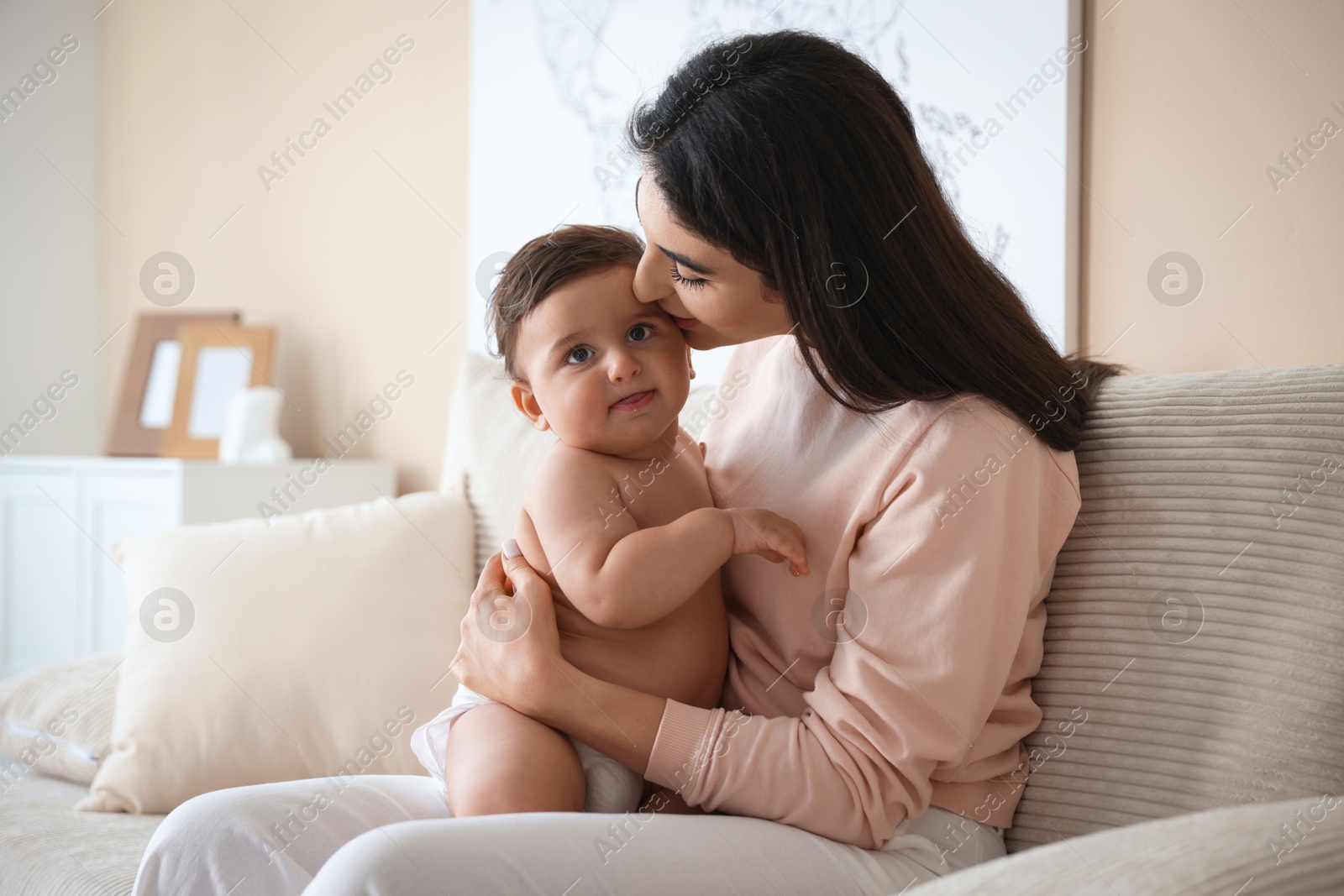 Happy mother with her cute little baby at home Photo of Happy mother with her cute little baby at home