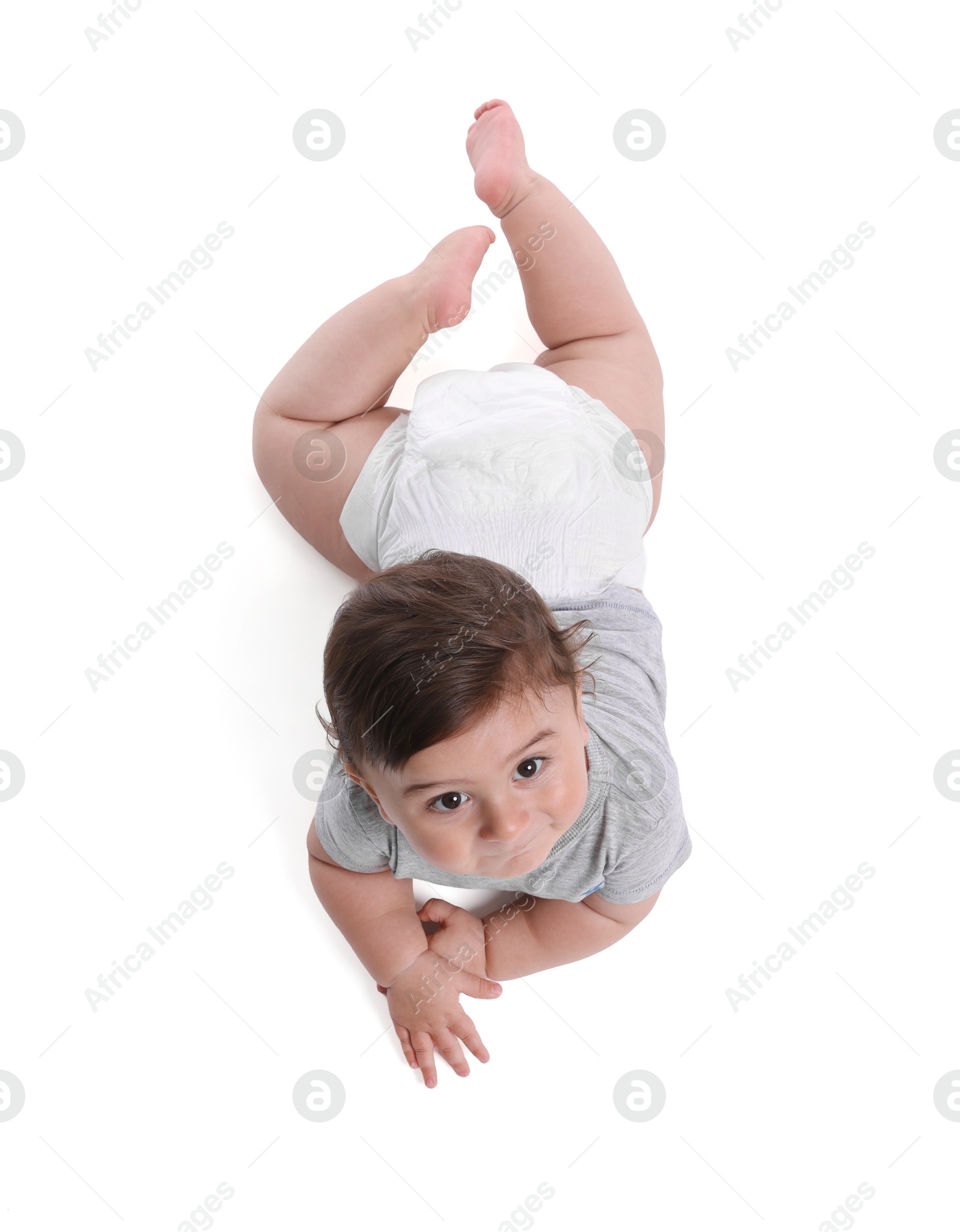 Cute little baby crawling on white background, above view Photo of Cute little baby crawling on white background, above view