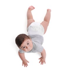 Photo of Cute little baby crawling on white background, above view