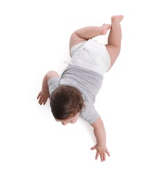 Photo of Cute little baby crawling on white background, above view