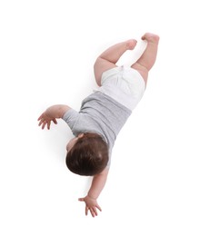 Photo of Cute little baby crawling on white background, above view