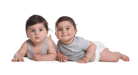 Photo of Cute little twin babies on white background