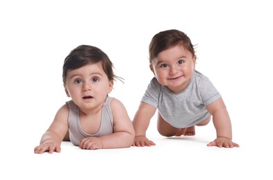 Photo of Cute little twin babies on white background