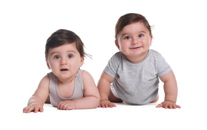 Photo of Cute little twin babies on white background