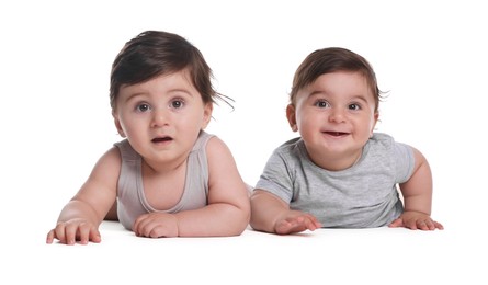Photo of Cute little twin babies on white background