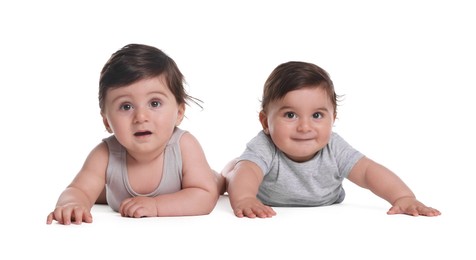 Photo of Cute little twin babies on white background