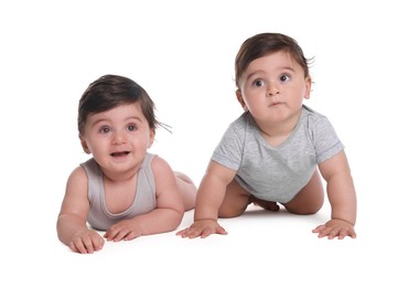 Photo of Cute little twin babies on white background