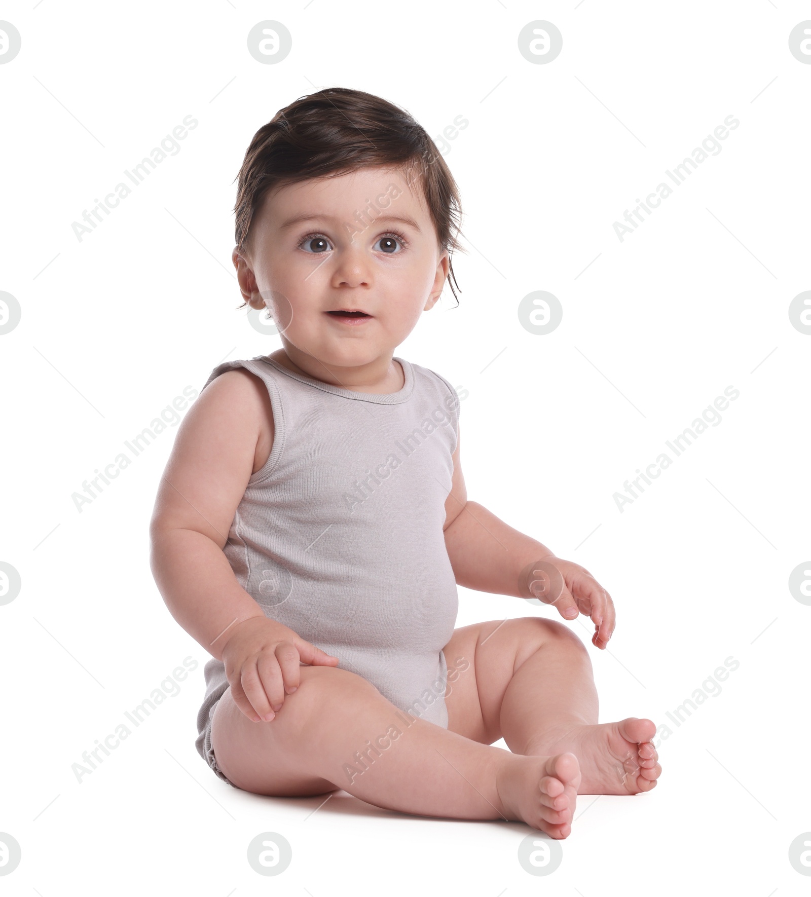 Photo of Cute little baby sitting on white background