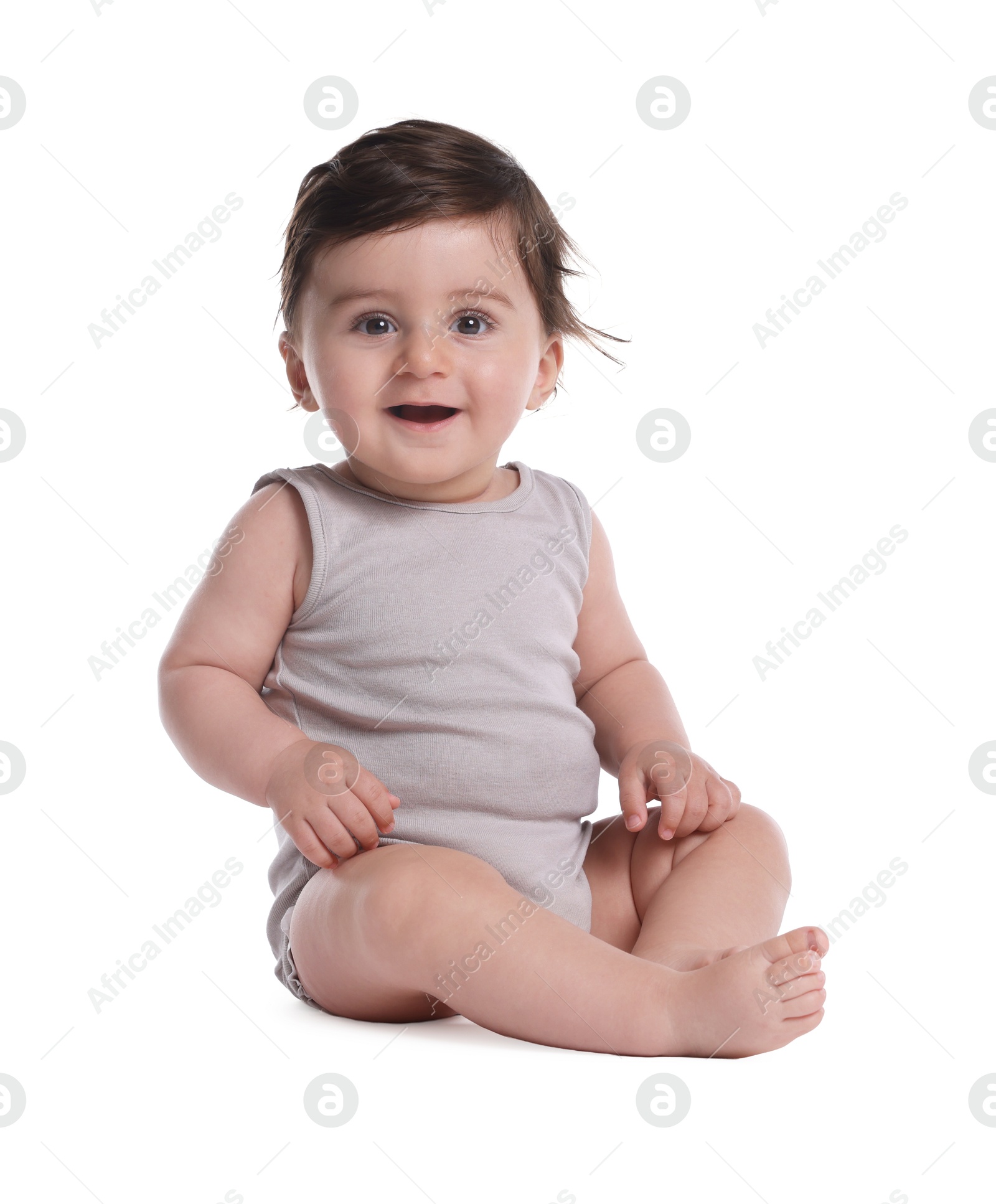 Photo of Cute little baby sitting on white background