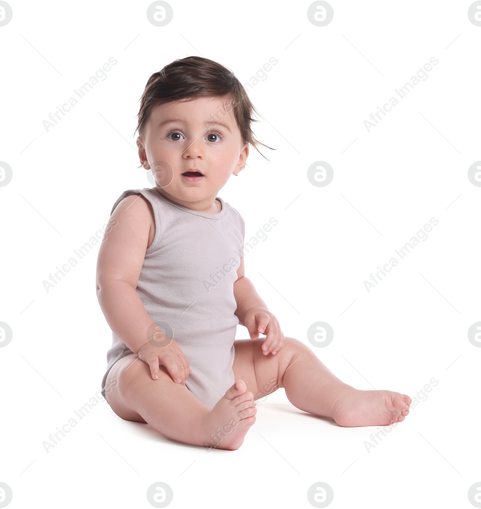 Cute little baby sitting on white background Photo of Cute little baby sitting on white background