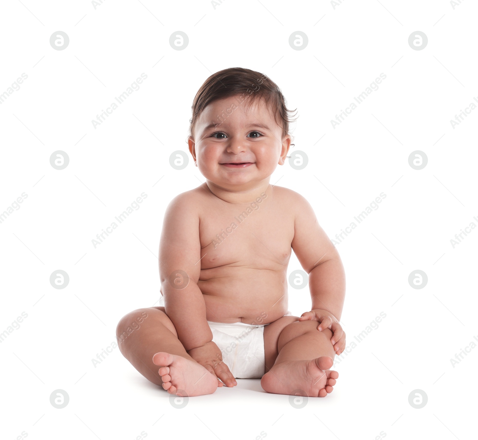 Photo of Cute little baby sitting on white background