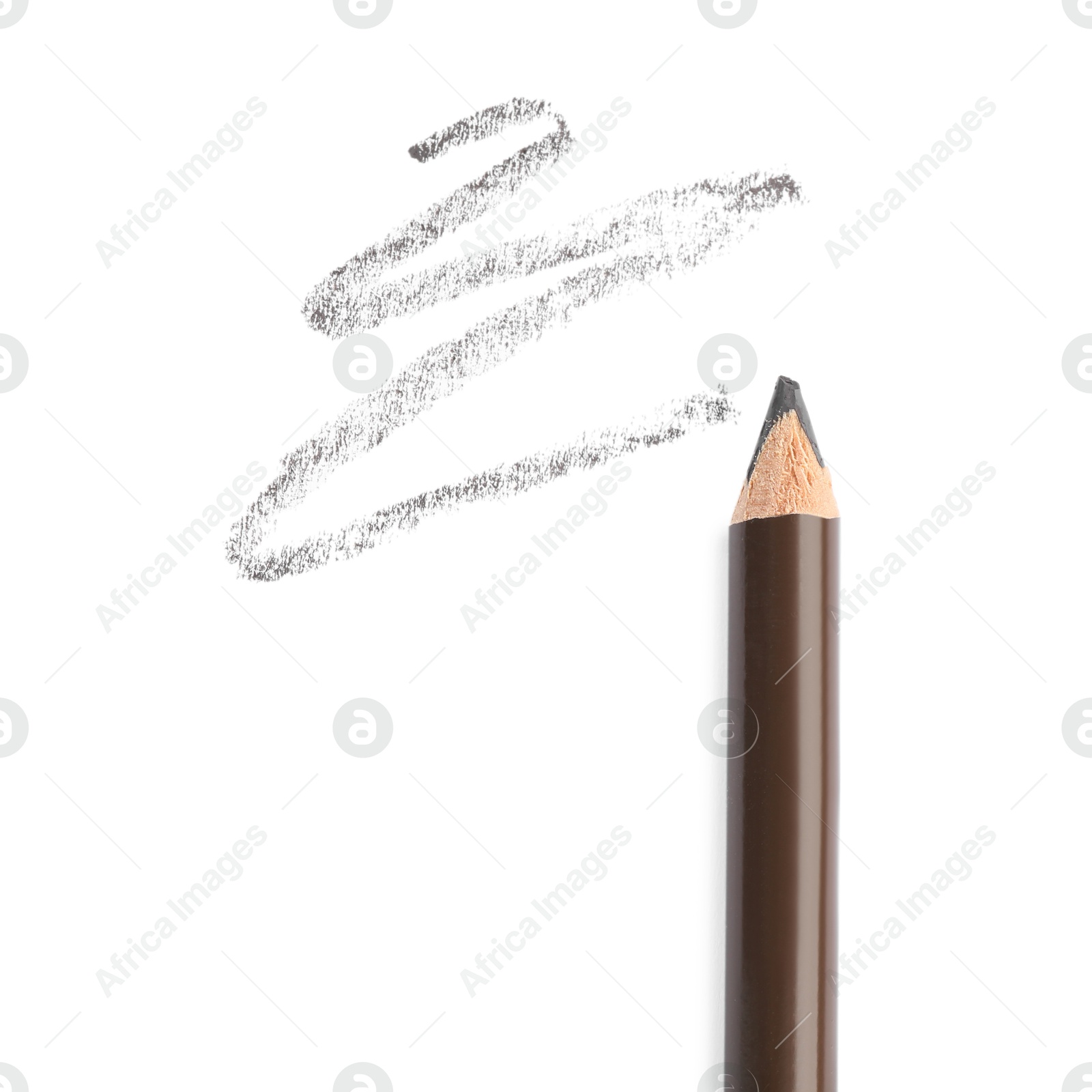 Eyebrow pencil and strokes isolated on white, top view Photo of Eyebrow pencil and strokes isolated on white, top view