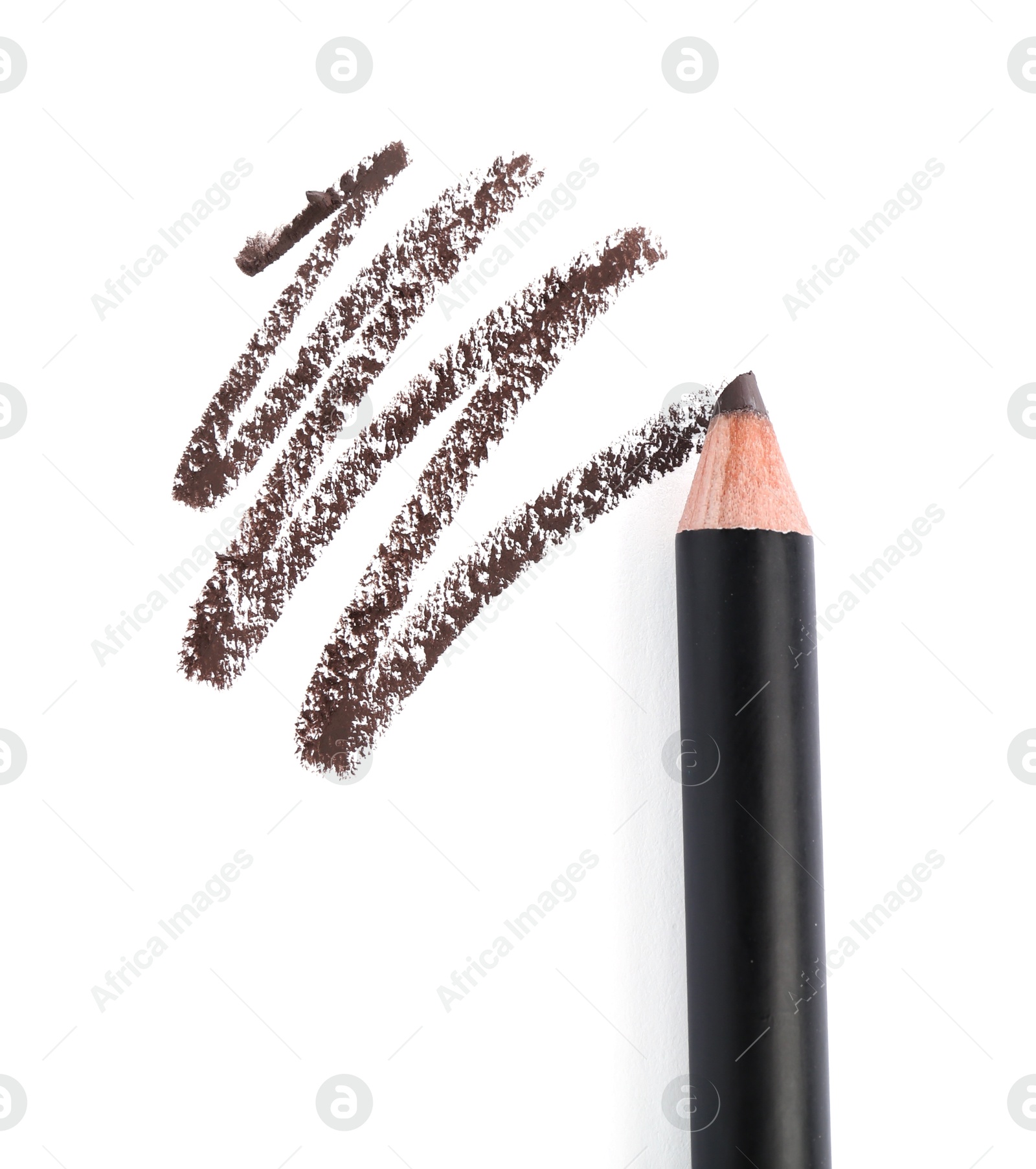 Eyebrow pencil and strokes isolated on white, top view Photo of Eyebrow pencil and strokes isolated on white, top view