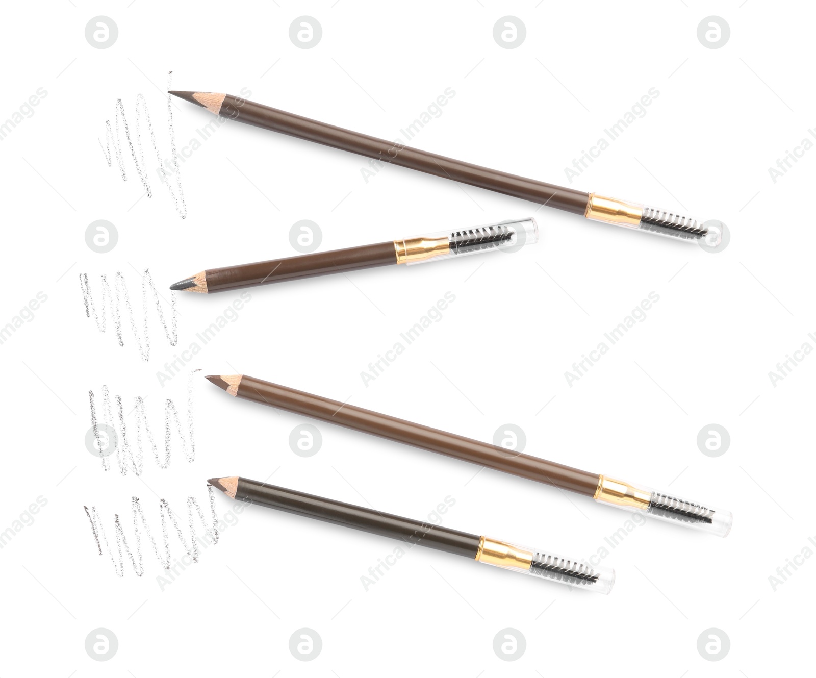 Photo of Eyebrow pencils and strokes isolated on white, top view
