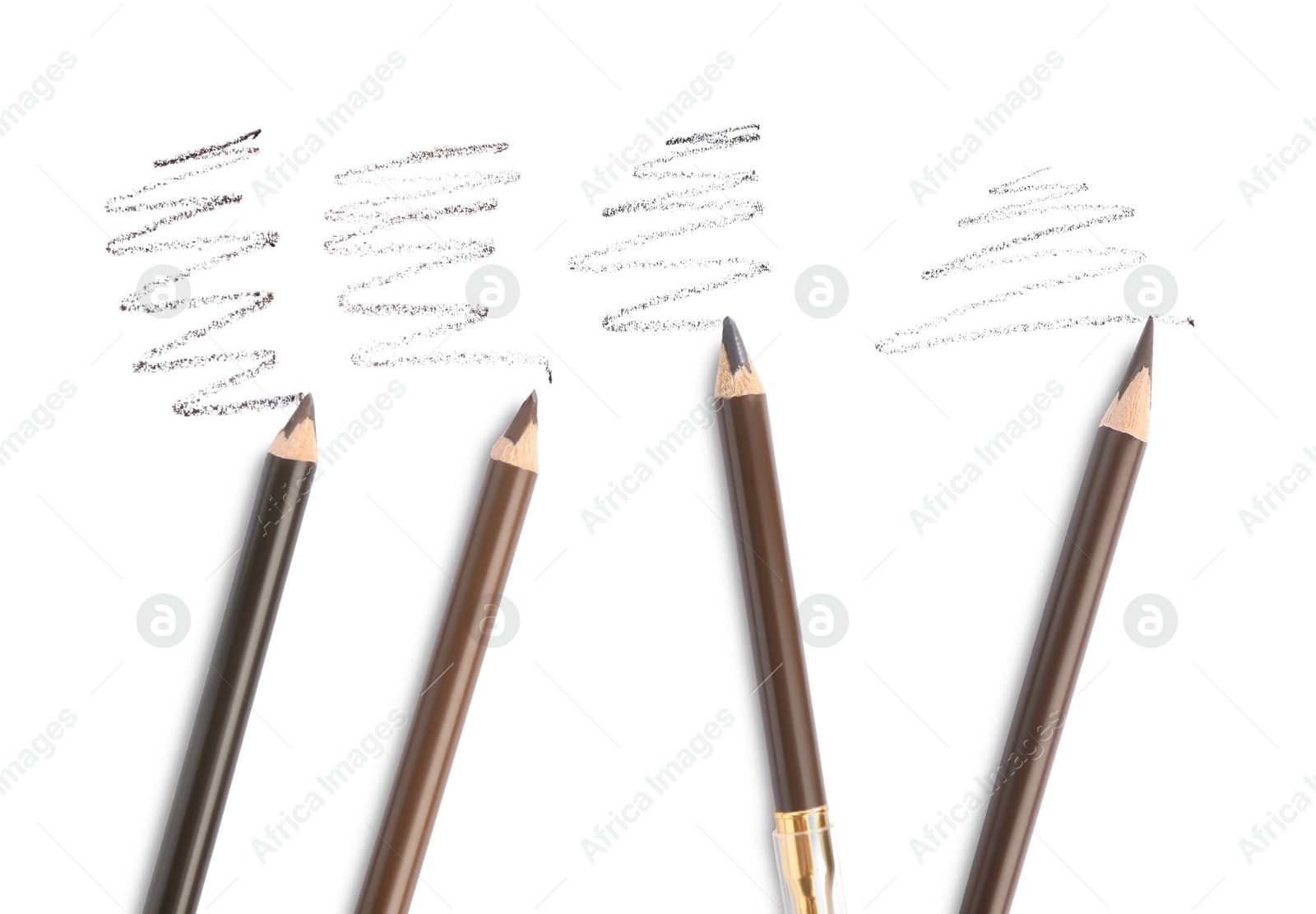 Photo of Eyebrow pencils and strokes isolated on white, top view